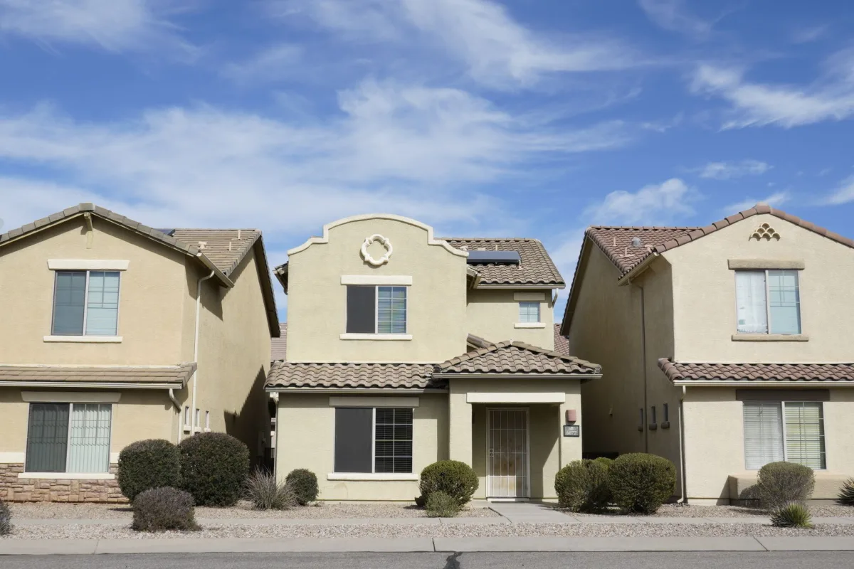 A rooftop evaporative cooler on a desert home with a Terrestream sensor showing elevated indoor humidity.