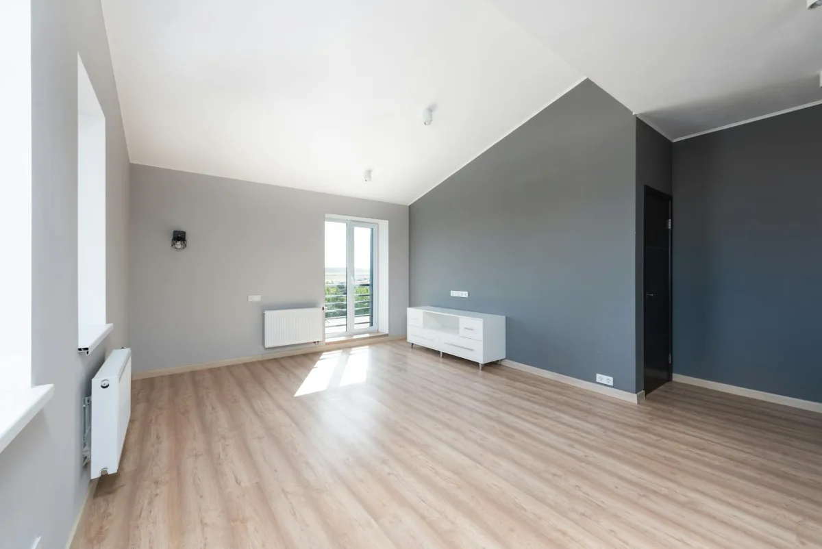 A freshly renovated kitchen with windows open and box fans running, a Terrestream sensor showing elevated VOC index, and a calendar marked "bake out day 2".