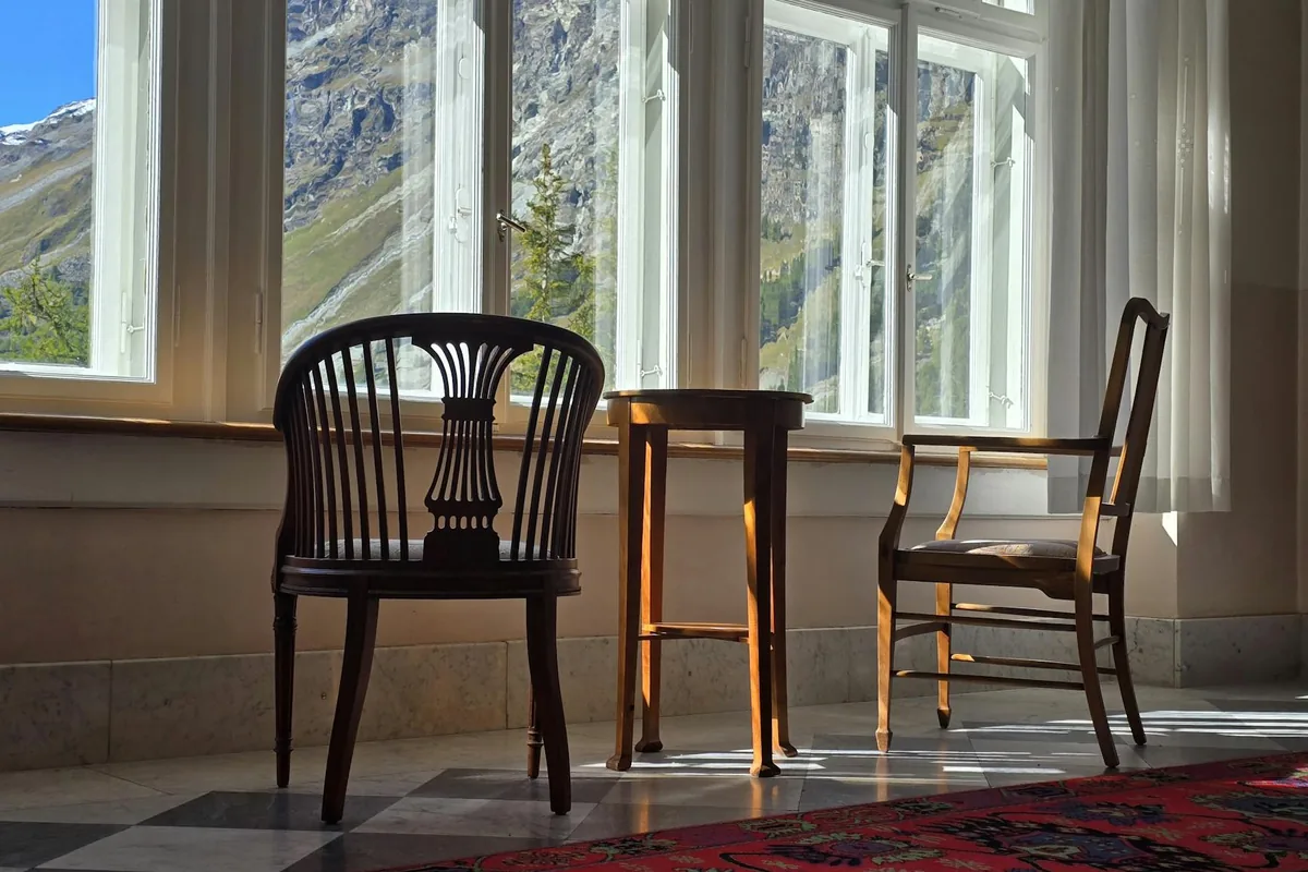 Sunlight refracting through a window onto a desk, casting bright rectangles.